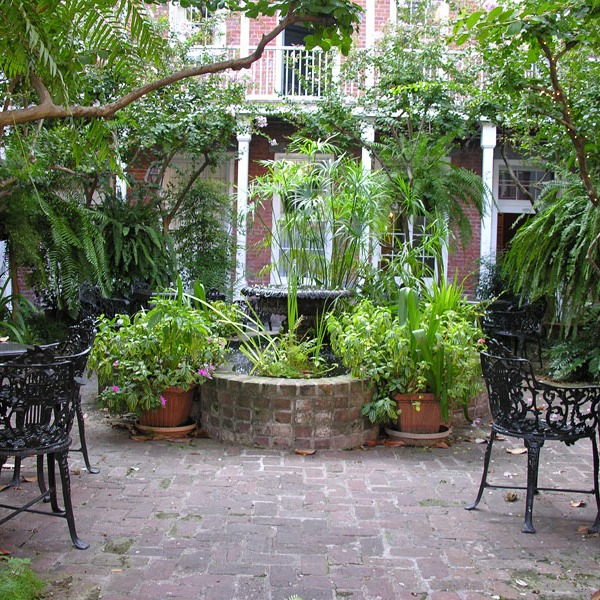classic fountain planted heavily in French Quarter courtyard