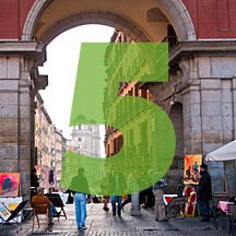 the number 5 superimposed over picture of archway and urban street beyond in Madrid, Spain