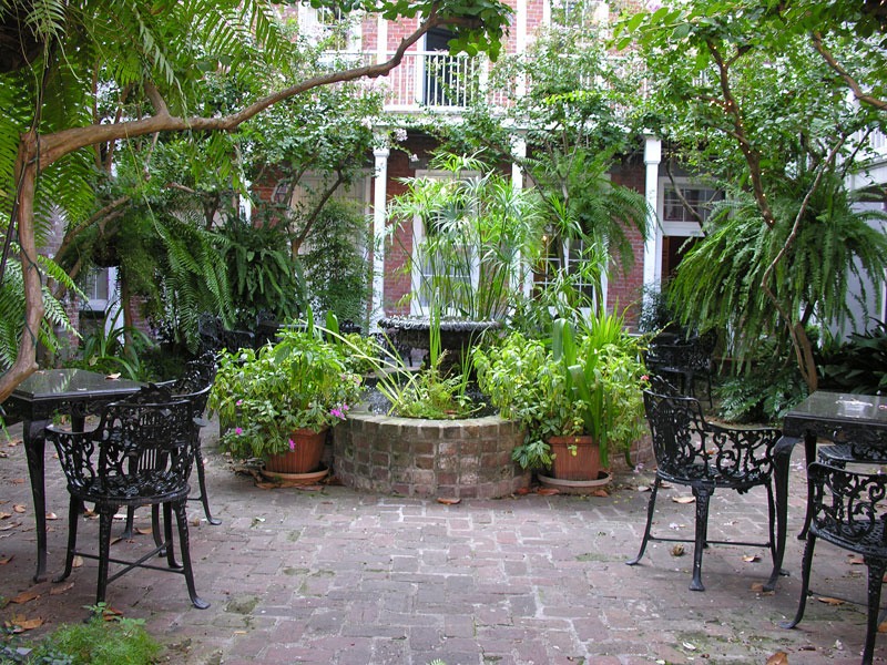 classic fountain planted heavily in French Quarter courtyard the