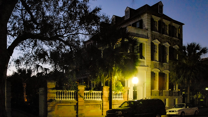 Charleston Single House along a street at nightfall