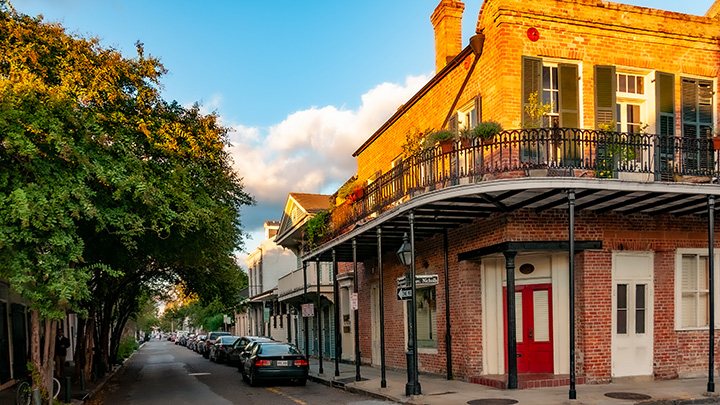 French Quarter street corner bathed in late afternoon sunlight