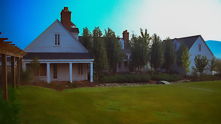 courtyard house opening onto a larger south-facing courtyard surrounded by an arbor