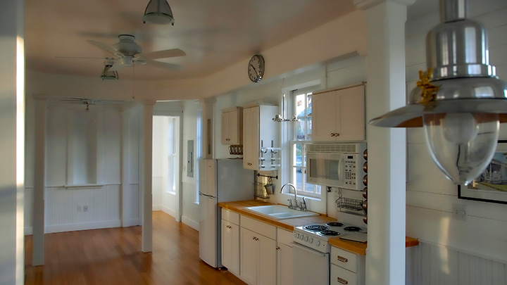 Katrina Cottage VIII kitchen with bed alcove to left