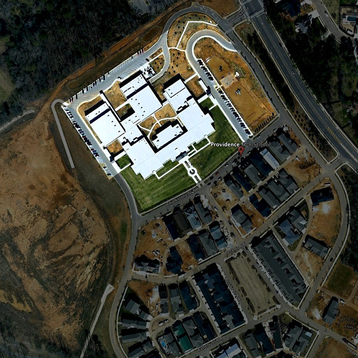 Providence School satellite photo showing school at edge of neighborhood
