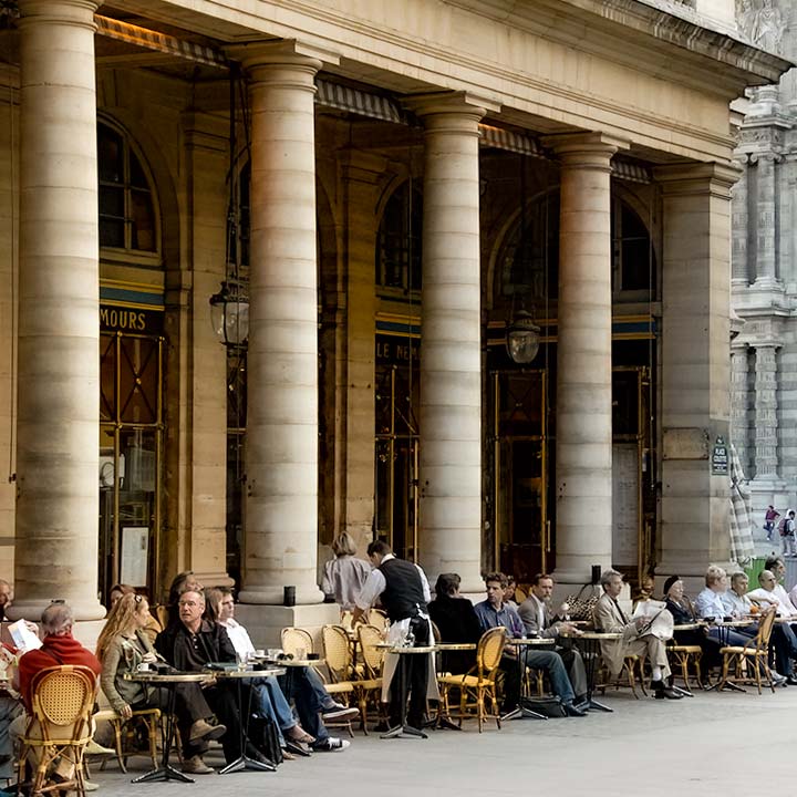 street cafe along colonnade of Palais Royale in Paris