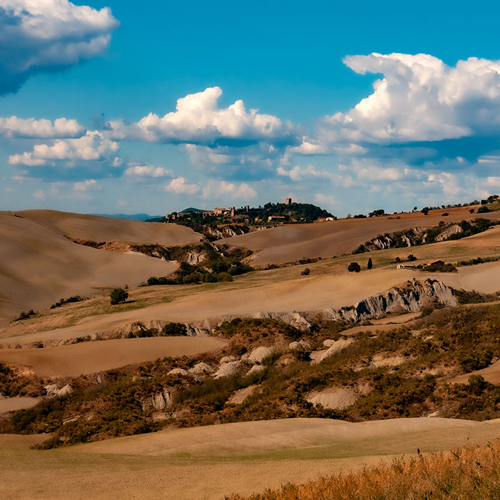 UNESCO World Heritage town of Pienza, Italy sitting in the distance in the Tuscan landscape