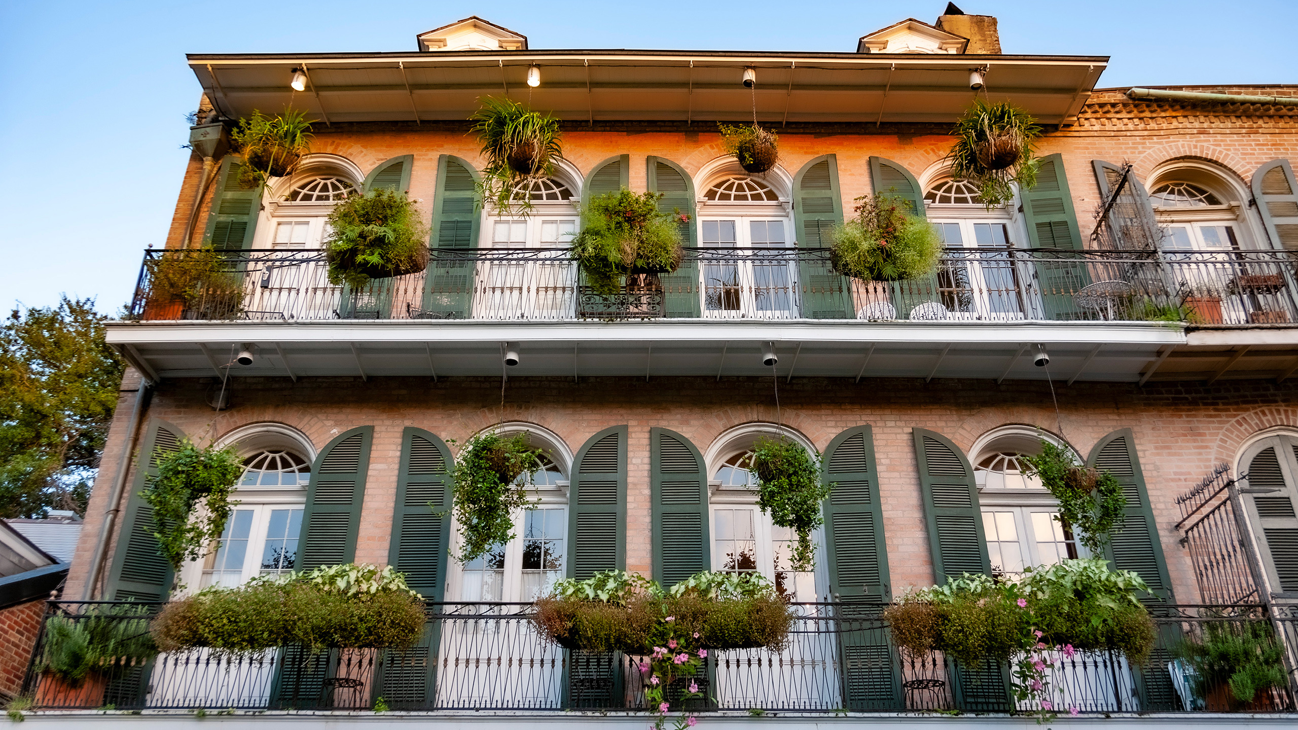 French Quarter building with balconies on upper level as gifts to the street