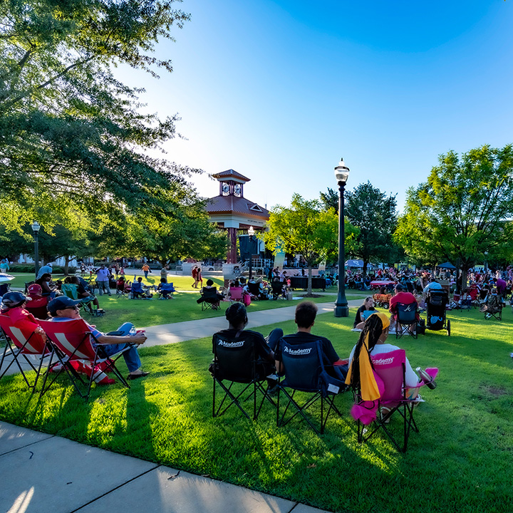 Tuscaloosa townspeople at a concert in the park