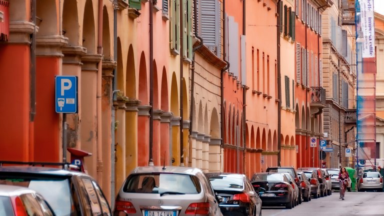A street full of all shapes and colors imaginable can be jarring-to-hideous, but a great variety in a narrow range of regionally-loved colors and patterns like these arcades is usually soothing and deeply-loved. &copy;2011 Stephen A. Mouzon