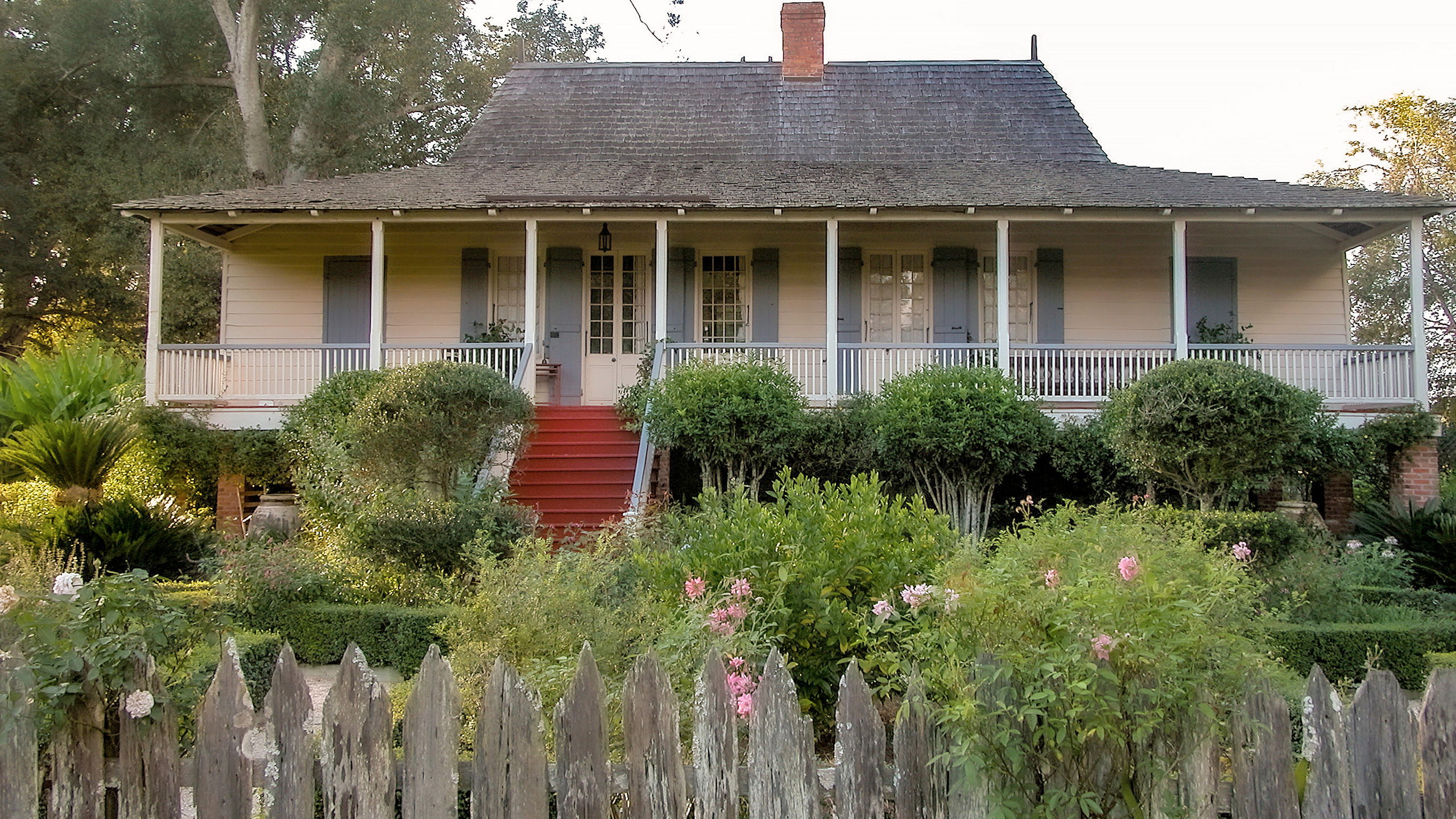 house in False River, Louisiana with bell-cast eaves