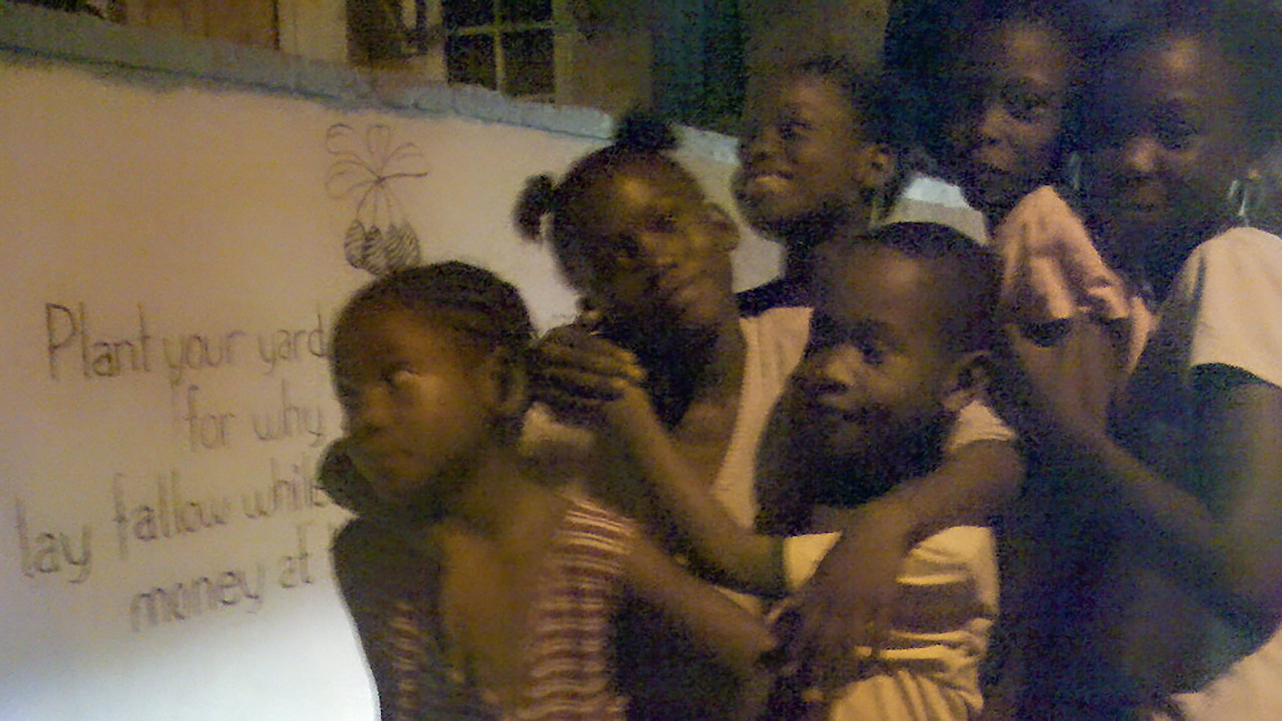 little children in Kingston, Jamaica turning an urbanism code into a song