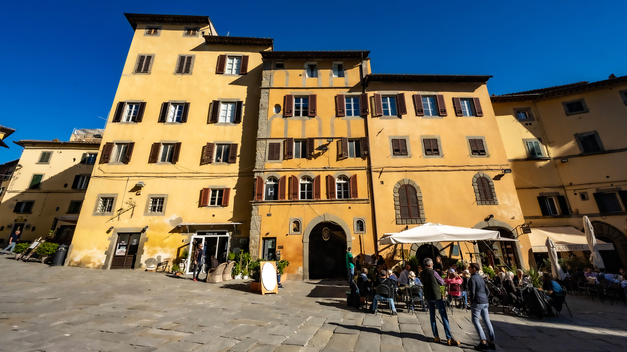 mixed-use buildings on a piazza in Cortona, Italy