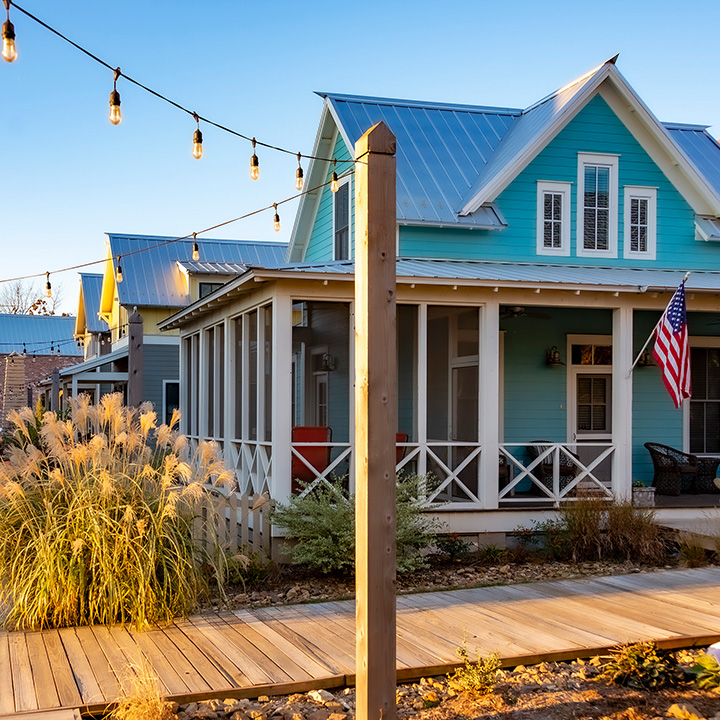 cottages set along Carlton Landing boardwalks in late afternoon sun
